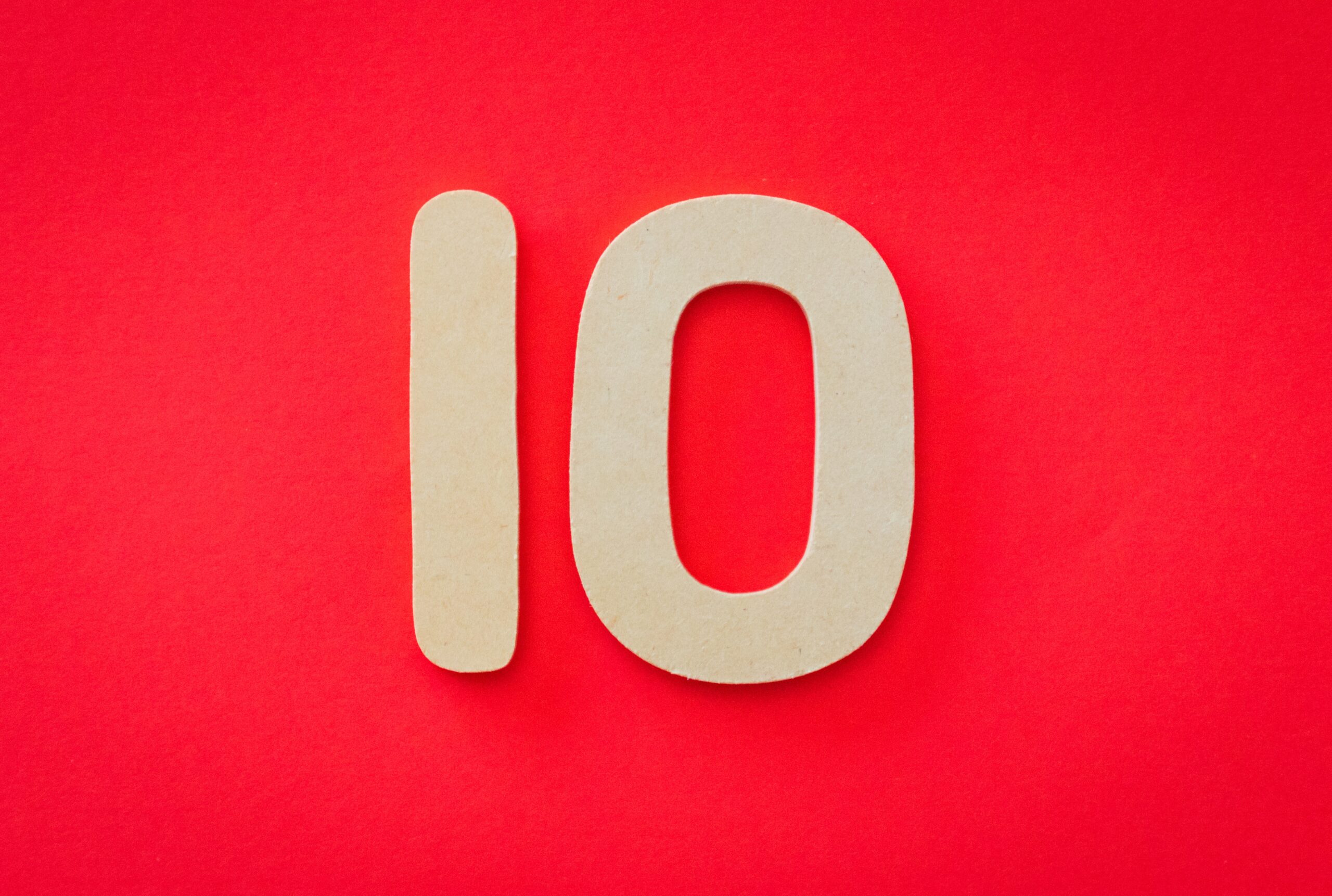 White number ten on red background